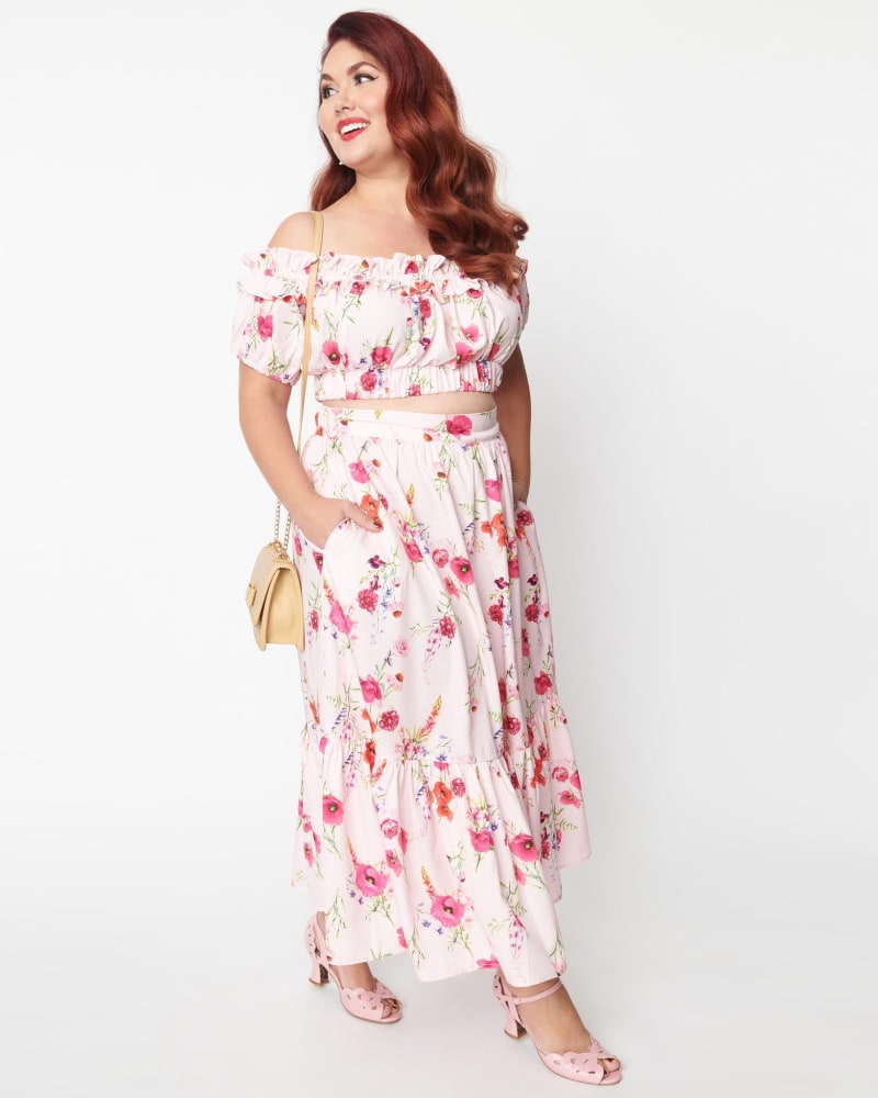 Front of a model wearing a size XL Unique Vintage Light Pink Floral Tiered Midi Skirt in Pink, Floral by Unique Vintage. | dia_product_style_image_id:287589